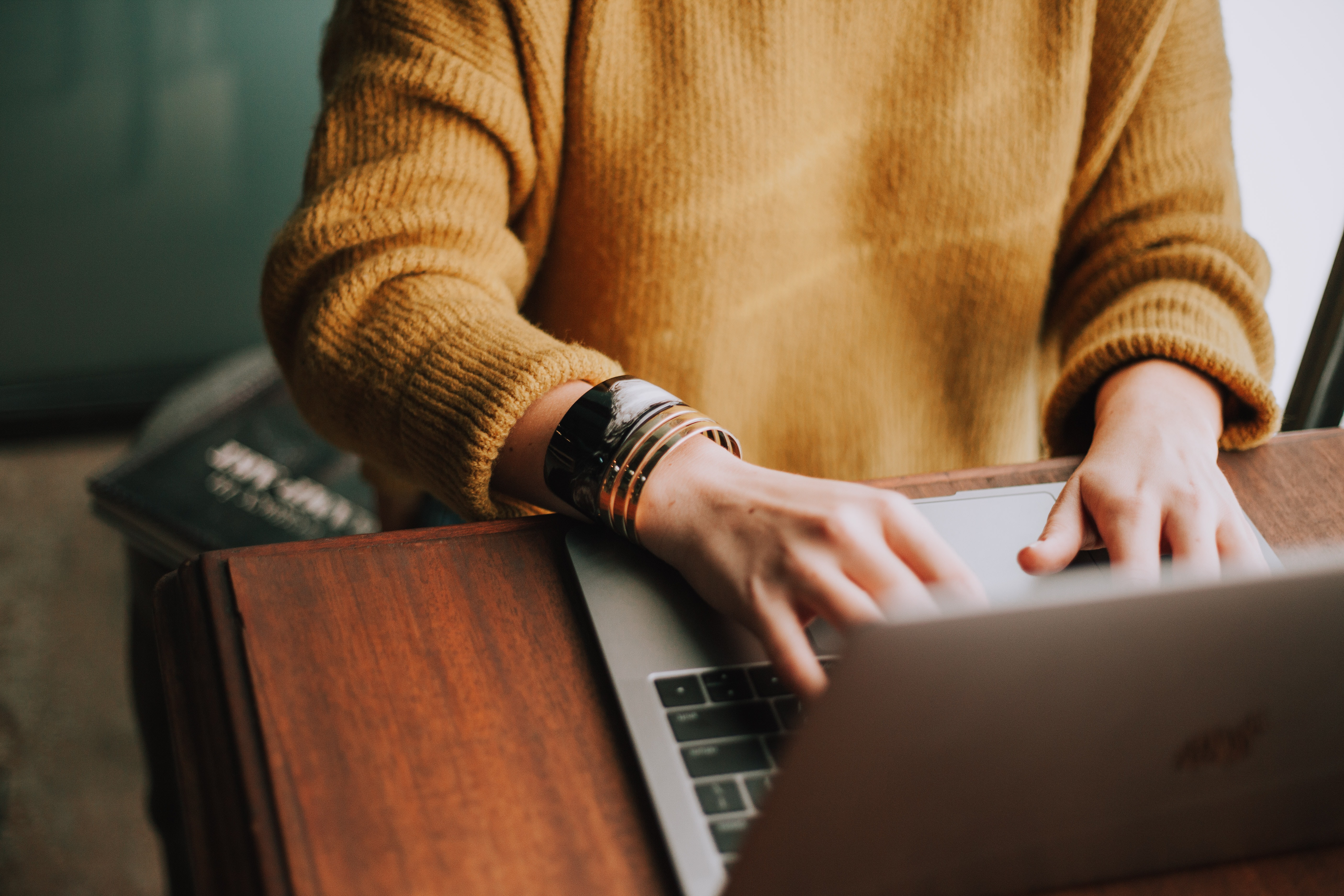 photo of person using laptop computer